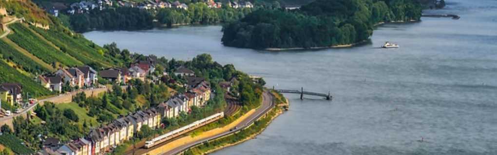 Happy travelers exploring a local European river port with Vincent Vacations